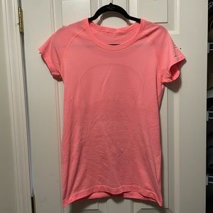 Neon pink/orange  lululemon short sleeve workout top, size 10
